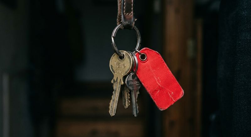 House keys on ring with emergency tag, security concept